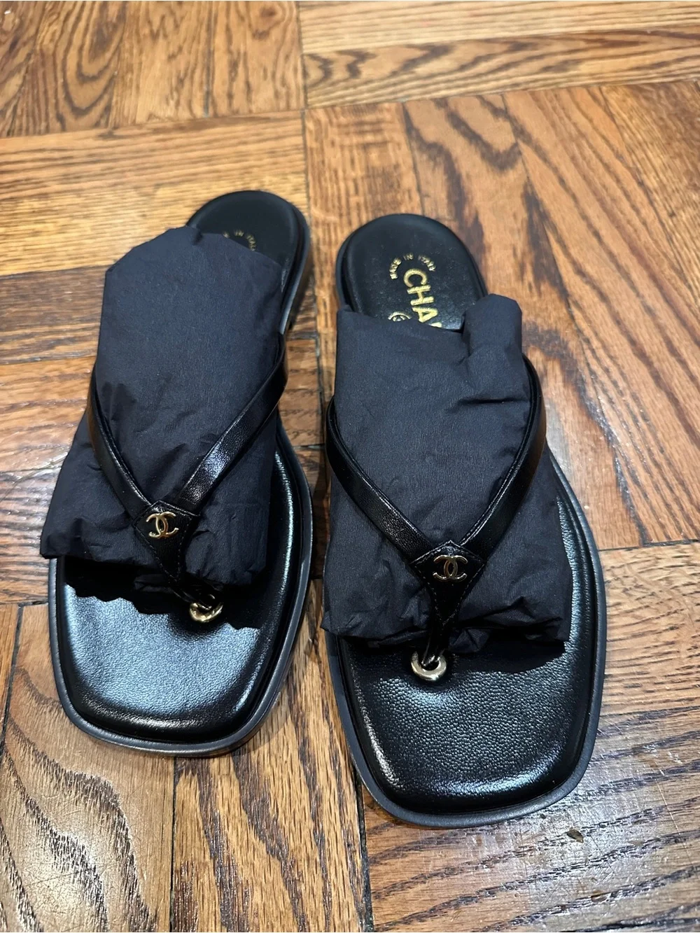 CHANEL Black Leather Logo Thong Sandals with Gold Accent